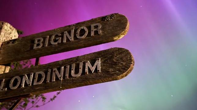 Lights over a wooden sign post