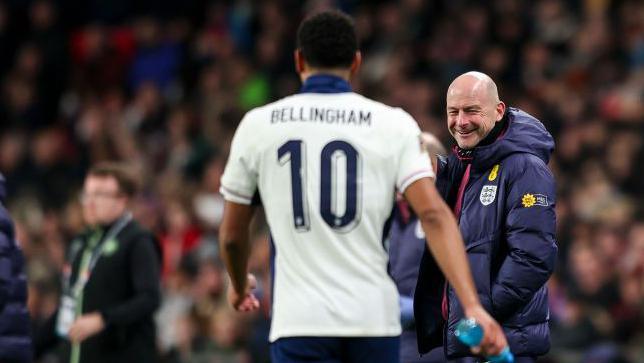 Lee Carsley smiles at Jude Bellingham 