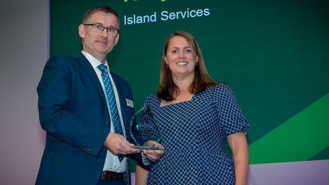 Two people at award ceremony