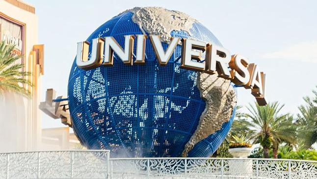 A large blue globe on display outside a Universal theme park in the USA.