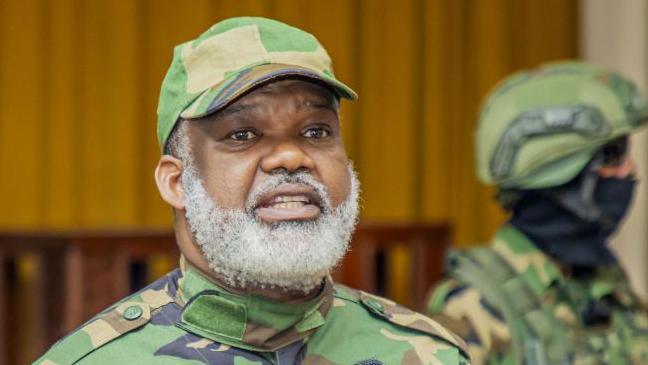  Corneille Nangaa, dressed in camouflage, speaks at a press conference at the Serena Hotel on 30 January in Goma, Democratic Republic of Congo