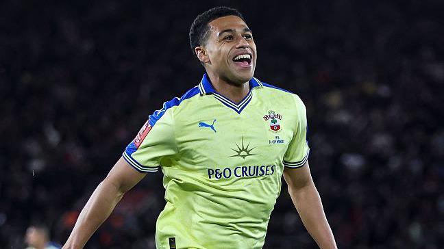 Shea Charles celebrates scoring against Arsenal