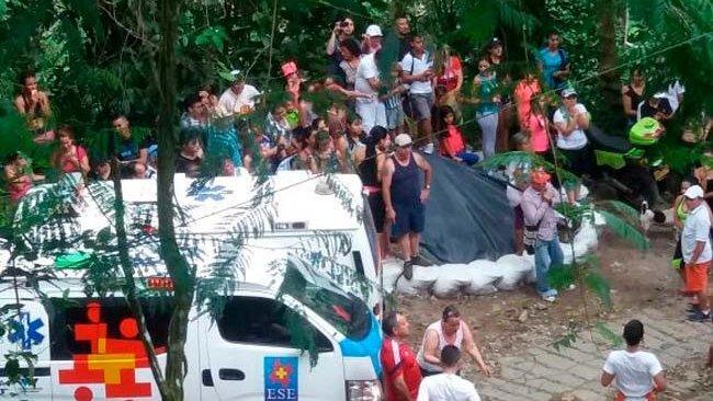 A photo by the National Disaster Risla Management Unit shows an ambulance near the site of the collapse