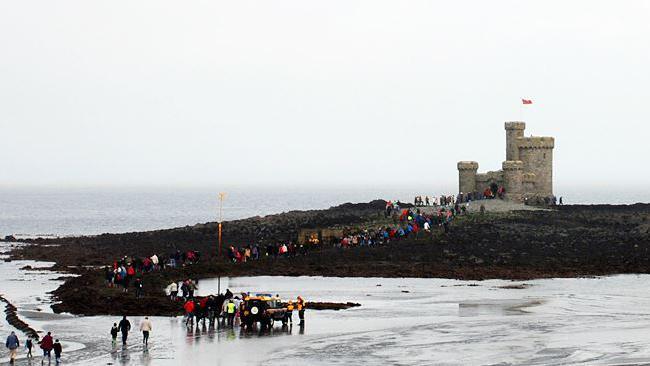 People walking to the Tower of Refuge