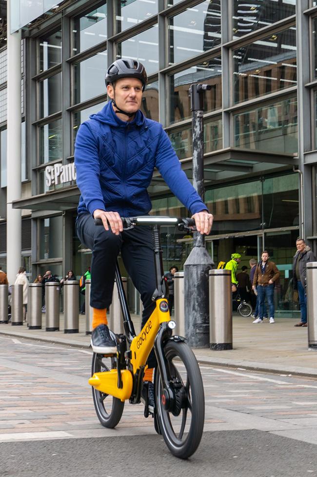 Dan Walker on bike in London