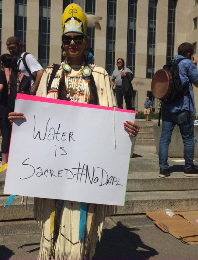 Activist Kim Sierra stands outside the US District Court in Washington to show her support for the Standing Rock Sioux tribe.