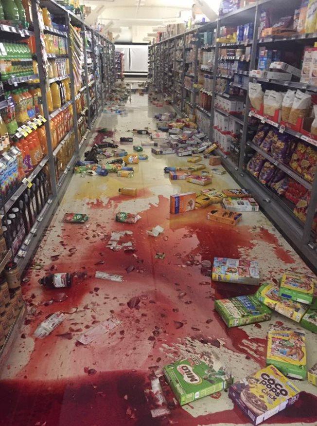 Bottles and boxes of cereals like broken on the floor of supermarket Fresh Choice Nelson City