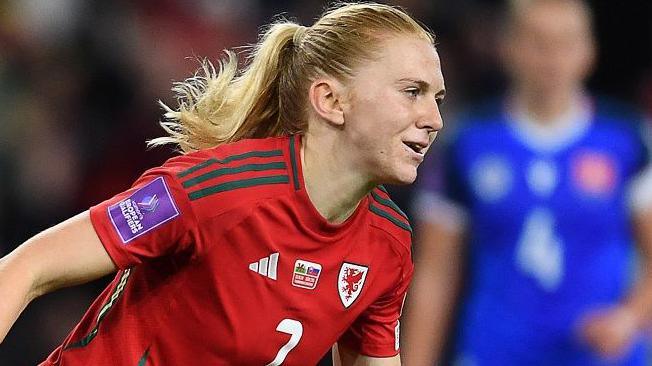 Liverpool midfielder Ceri Holland celebrates scoring for Wales against Slovakia