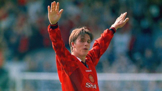 David Beckham celebrates scoring one of the most famous Premier League goals on the opening day of the 1996-97 season
