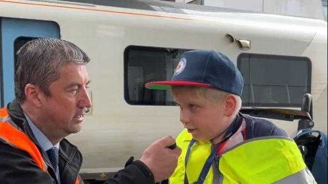 Alfie making a train platform announcement 