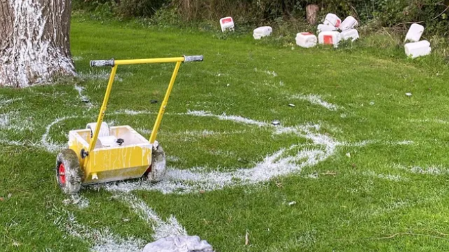 White paint is strewn across a football field in an apparent act of vandalism. 