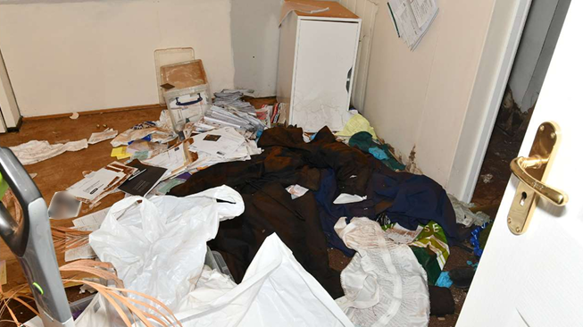 A filthy room, with rubbish strewn everywhere, at Legacy Independent Funeral Directors in Hull.