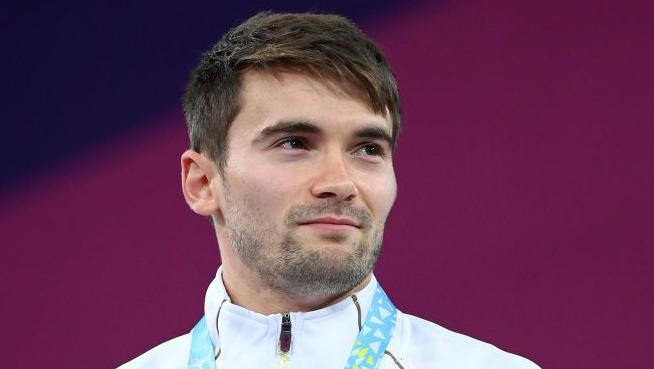 Olympic medallist Daniel Goodfellow on the podium