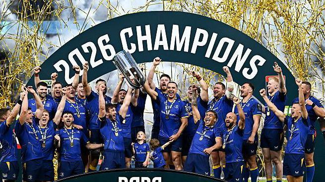 Leinster celebrate after receiving the URC trophy