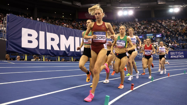 Kate Axford leads the 3,000m field at her first ever UK Indoor Athletics Championships, where she took the bronze medal