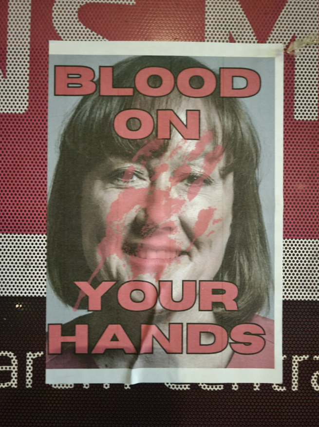 A poster of Jo Stevens is defaced with the words "blood on your hands"