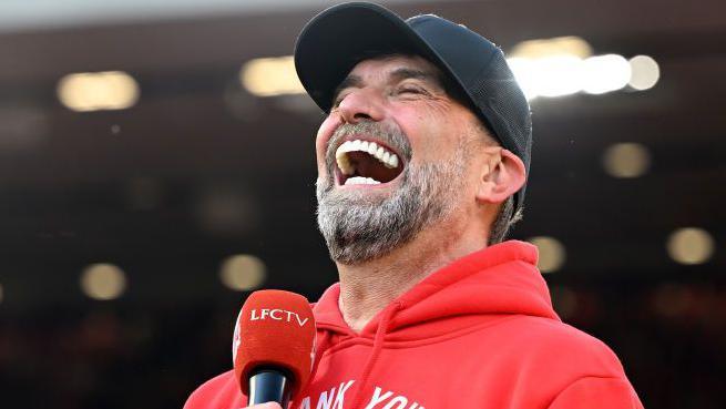 Klopp speaks to the crowd after the game