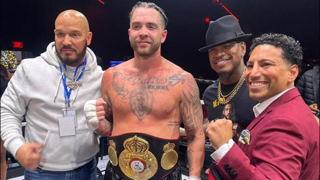 Paul Bamba poses for a photo with manager Ne-Yo after winning the WBA Gold Cruiserweight title 