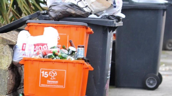 Recycling and black bins in Swindon street