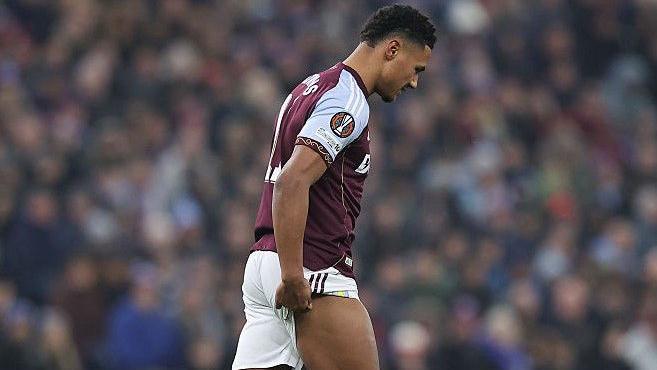 Ollie Watkins holds his hamstring