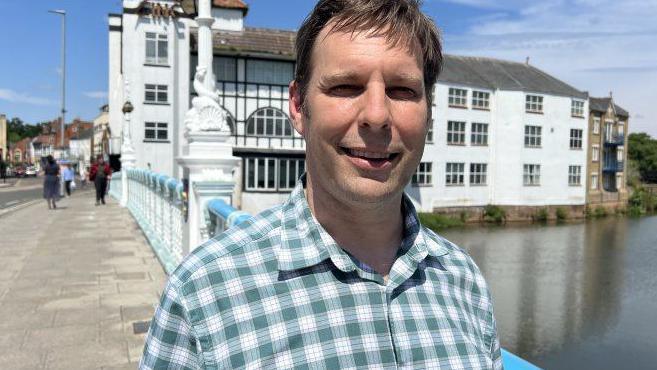 Councillor Richard Wilkins standing on the bridge