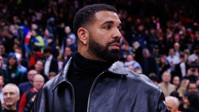 Drake in a leather jacket while courtside at the Golden State Warriors v Toronto Raptors NBA game in January 2025