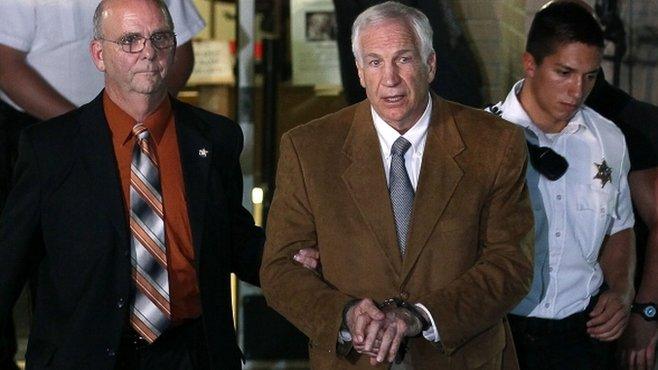 Jerry Sandusky leaves court in handcuffs