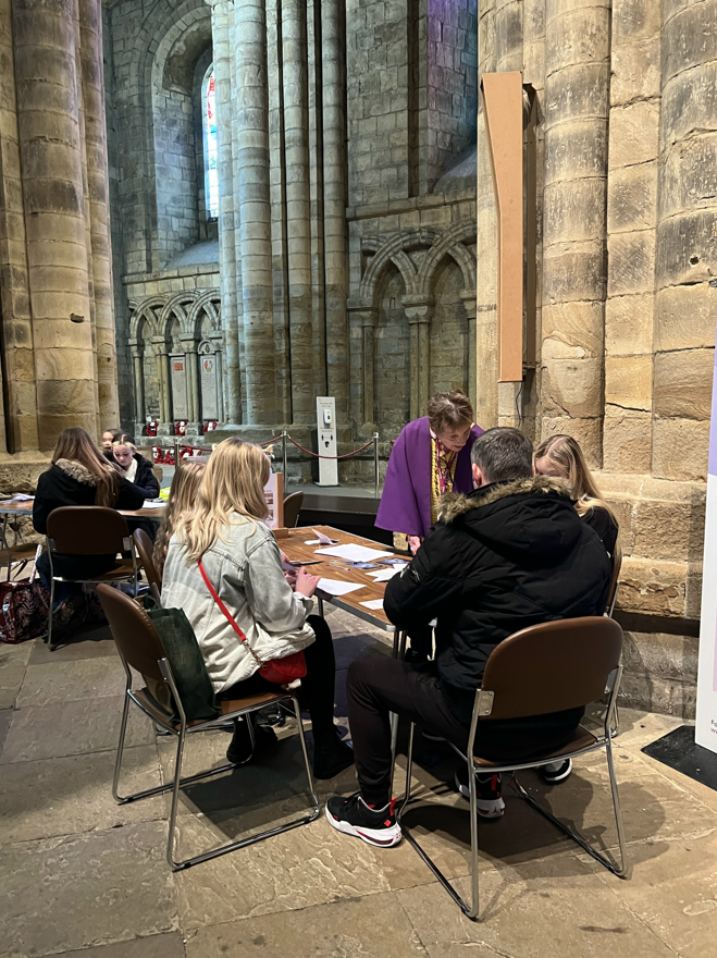 People creating peace doves at Durham Cathedral