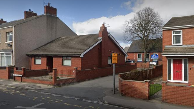 A bungalow next to a driveway leading to King Street Primary School.