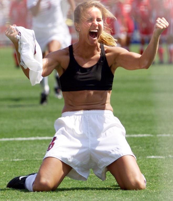 Brandi Chastain of the US shouts after falling on her knees after she scored the last goal in a shoot-out in the finals of the Women's World Cup with China at the Rose Bowl in Pasadena, California 10 July 1999.