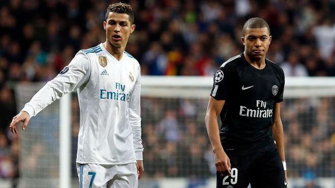 Cristiano Ronaldo and Kylian Mbappe playing against each other in 2018