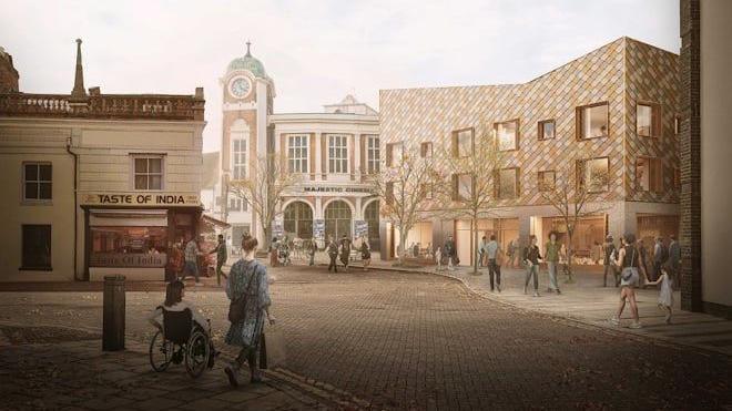 Artist's impression of what the new library in the town centre will look like. It has a chequer board pattern on its front and is surrounded by trees.