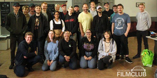  Newcastle Film Club volunteers posing for a group cast photo on a film set