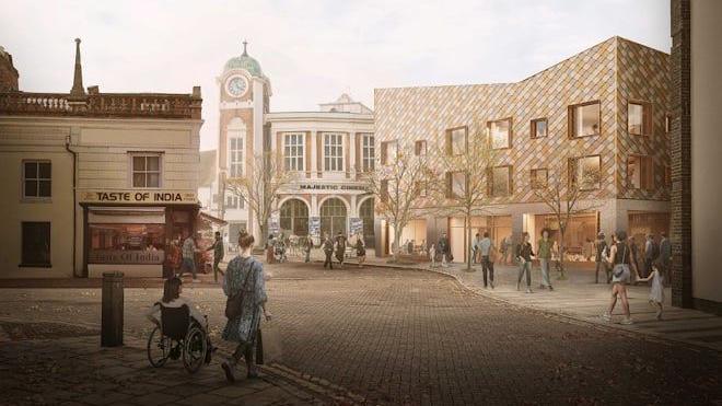 An artist's impression of how the King's Lynn library will look once it is complete. The three story building is clad in diamond shaped tiles and has lots of large windows. Behind it is the Majestic cinema.