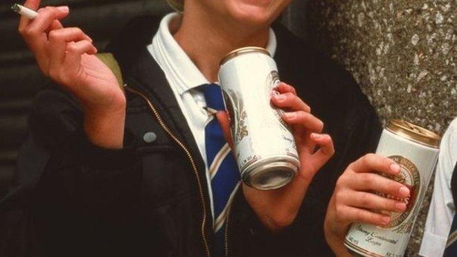 Schoolchildren drinking beer