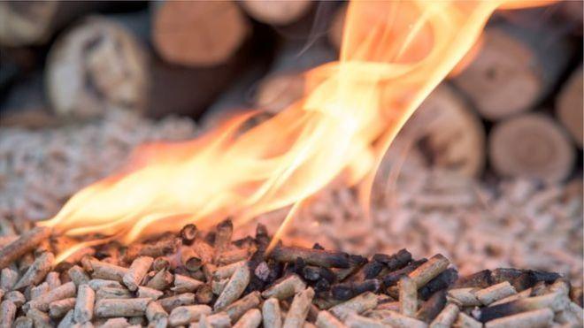 Burning wood pellets