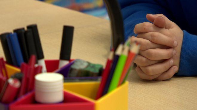 A child sits in a classroom