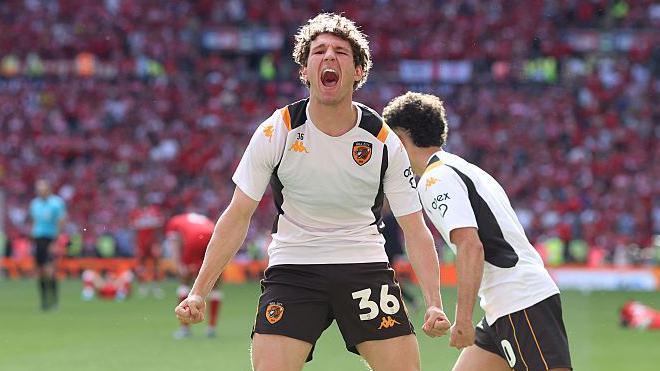 Lewis Koumas celebrates Hull City's promotion