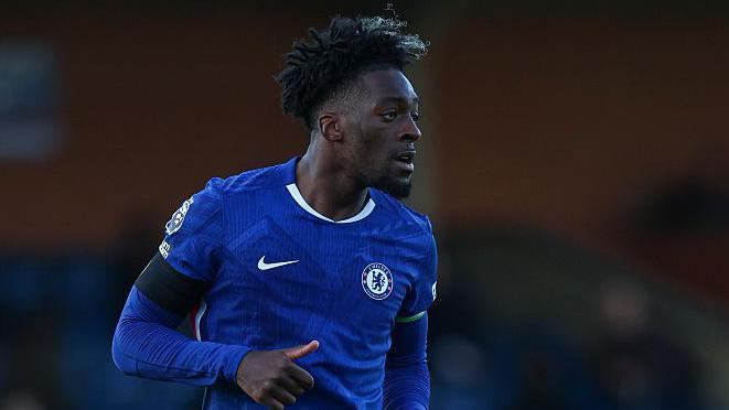 Axel Disasi looking across the pitch while playing for Chelsea's Under-21s