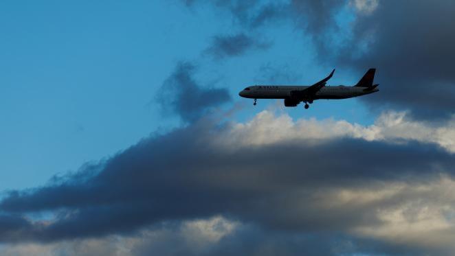 Airliner flying through clouds