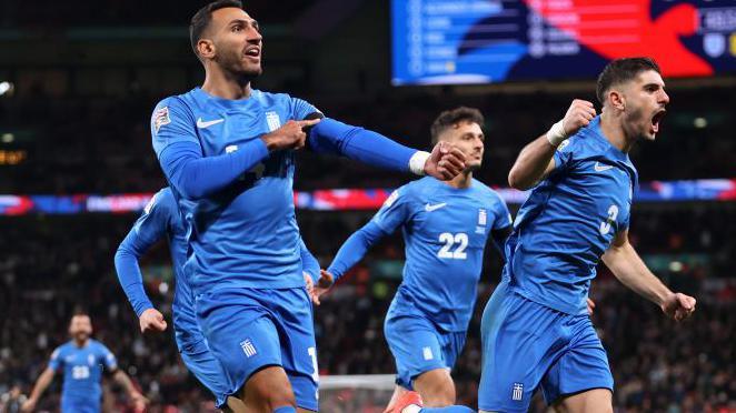 Vangelis Pavlidis celebrates puting Greece ahead against England at Wembley