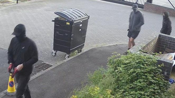 CCTV image of men