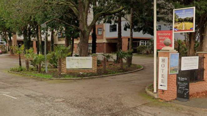 A Google Street View image of the front entrance to the Westone Manor Hotel.