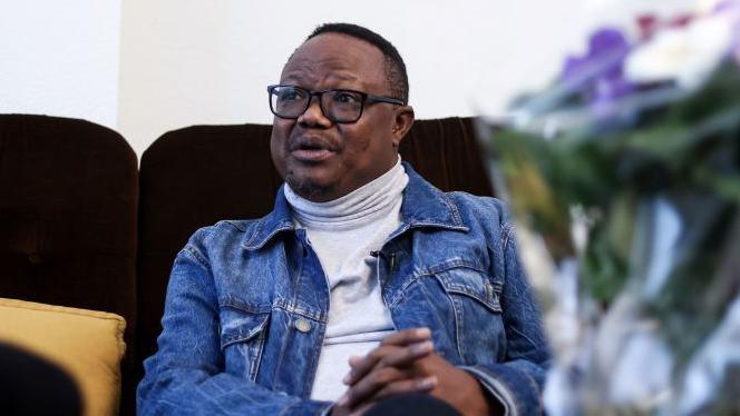 Tanzanian opposition leader Tundu Lissu speaks during an interview with AFP at his home in Tienen, on November 14, 2020.