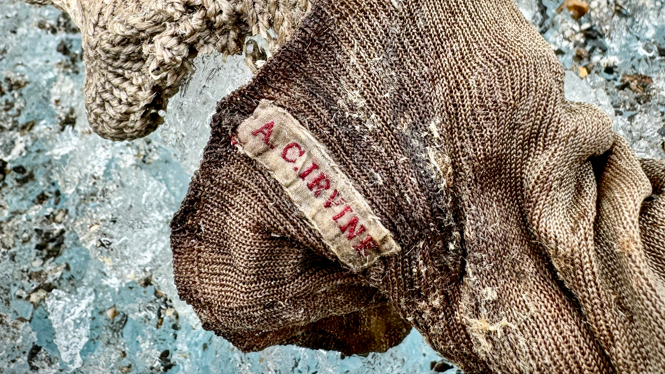 A sock embroidered with "A.C. Irvine", along with a boot, has been discovered on the Central Rongbuk Glacier below the North Face of Mount Everest by a team led by Jimmy Chin.