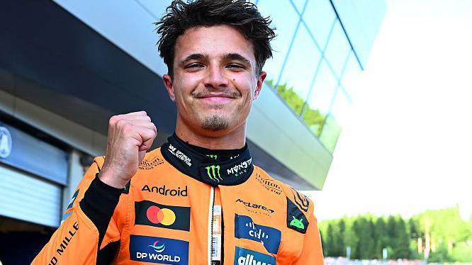 Lando Norris clenches his right fist in celebration after taking pole position for the Austrian Grand Prix