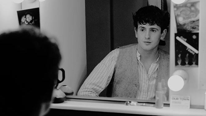 Alfie Llewellyn looks at himself in a mirror in the dressing room