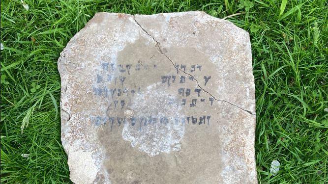 A stone slab with writing on it