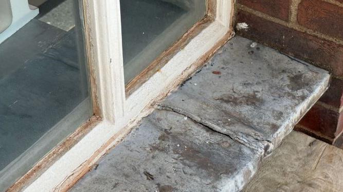 A close up picture of lead flashing on a window