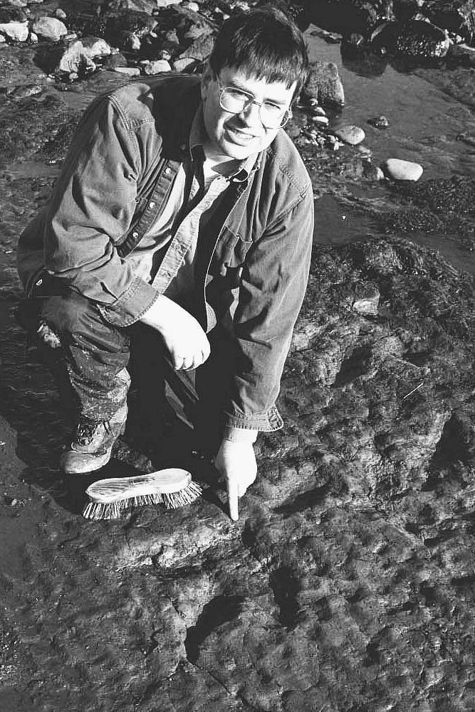 Dr Neil Clark and fossil footprint